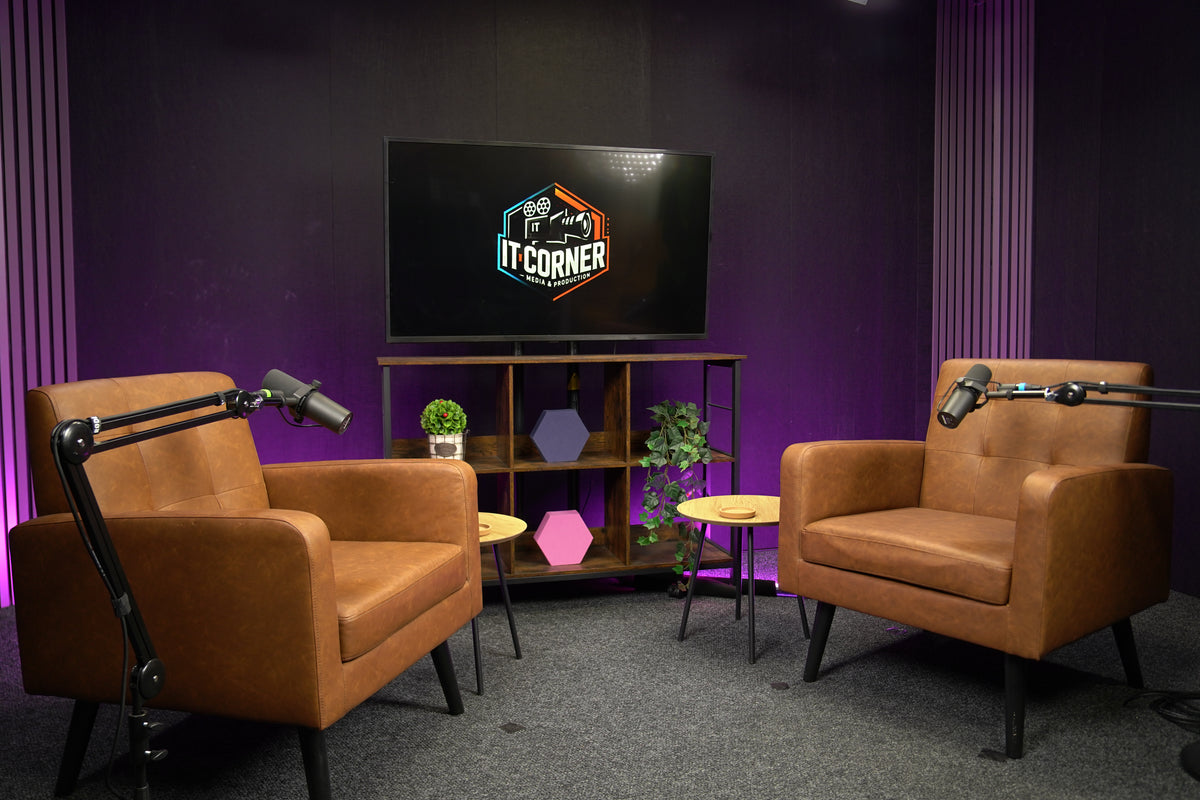 Professional podcast studio setup in Sofia with two armchairs, studio microphones, LED background lighting, and TV screen for video podcast recording and interview production